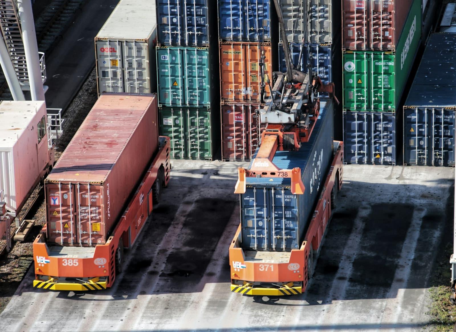 Freight containers stacked in tiers at a port terminal.