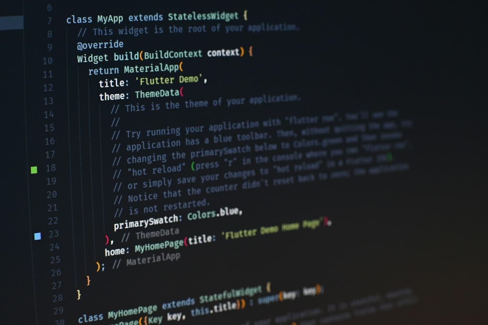 Syntax-highlighted source code on a dark editor screen, shown at a shallow angle.